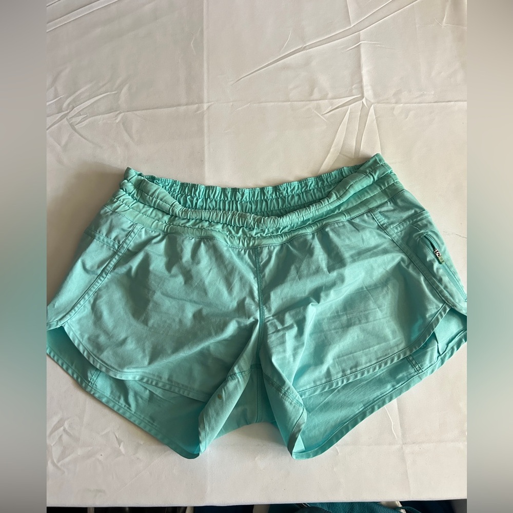 Lululemon light weight aqua coloured shorts size 10